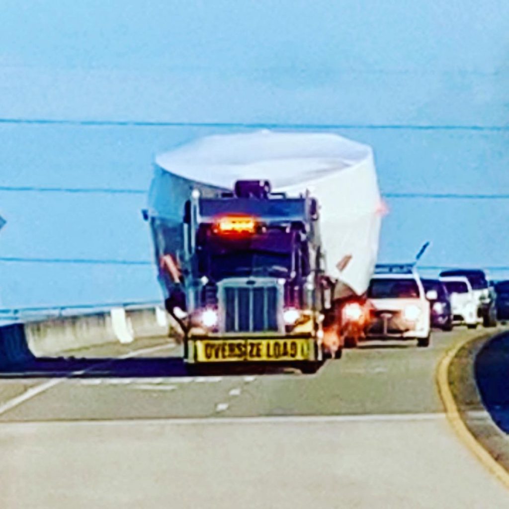 boat being hauled by semi-truck